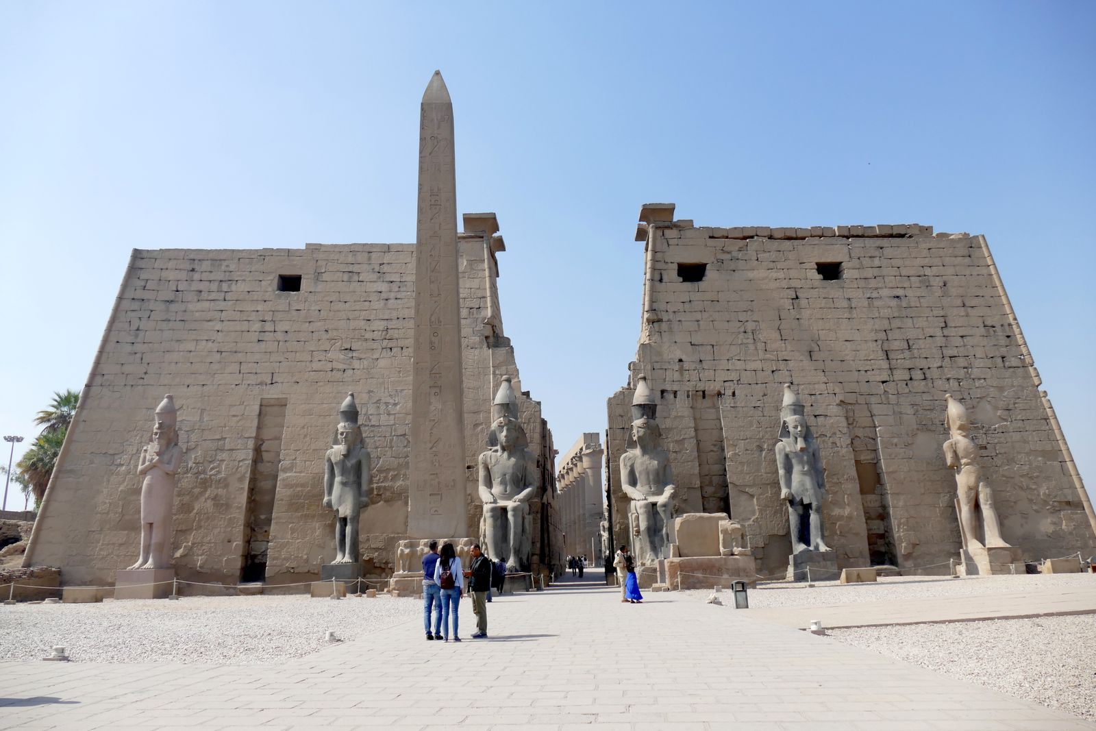 Visitors at the entrance pylon and obelisk of Luxor Temple, a standard stop on every Egypt river cruise